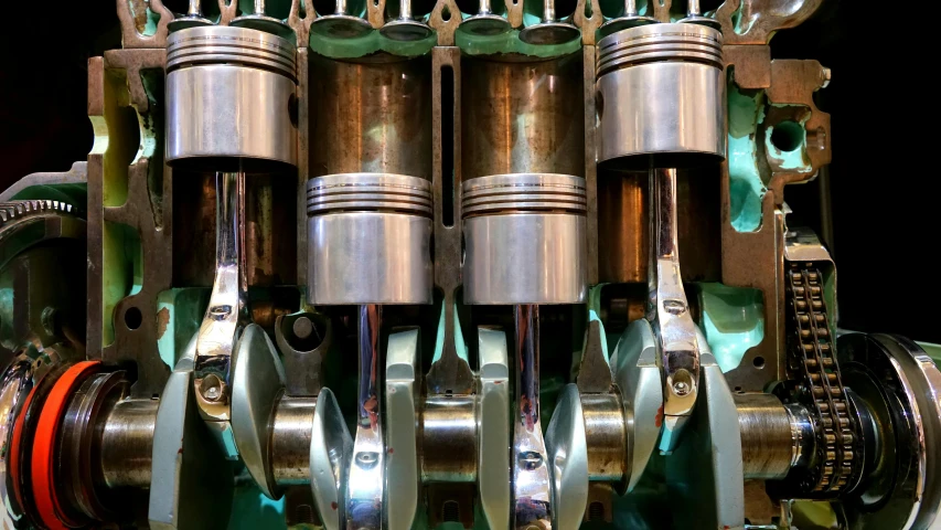 a group of metal parts sitting inside of a room