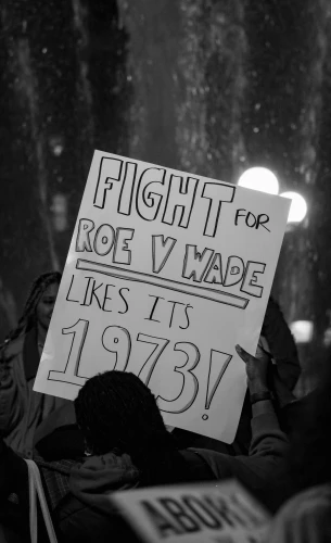 a protest sign in a black and white po