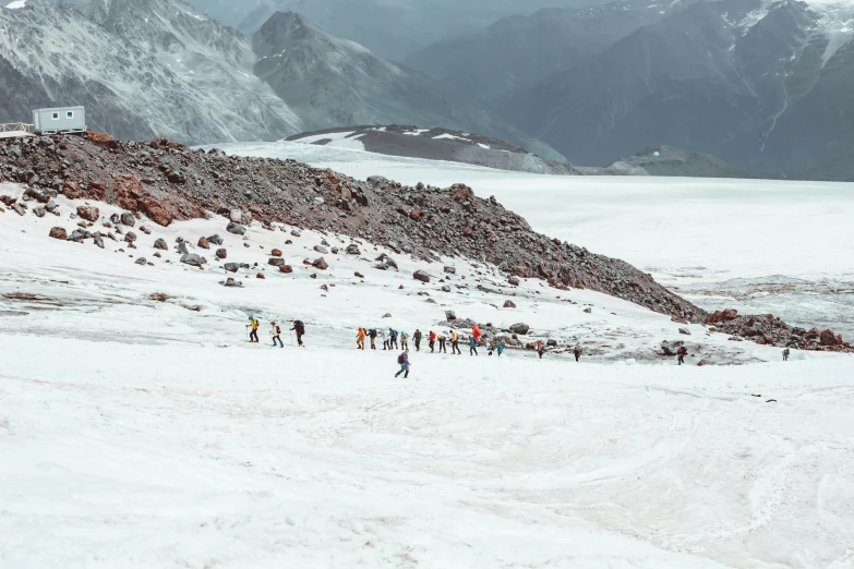 skiers standing in the snow in a snowy landscape