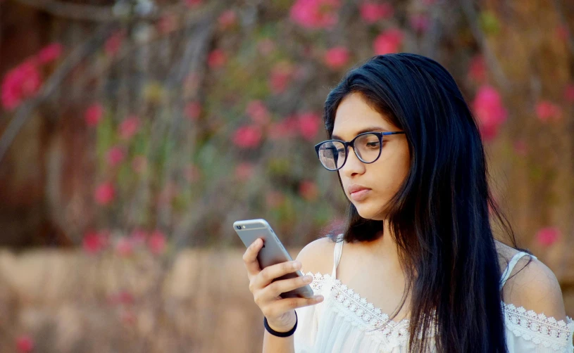 an image of a girl looking at her cell phone