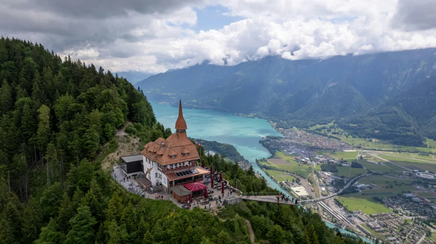 a large church in the middle of green mountains