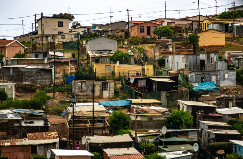 the picture shows a large city with some poor houses on top