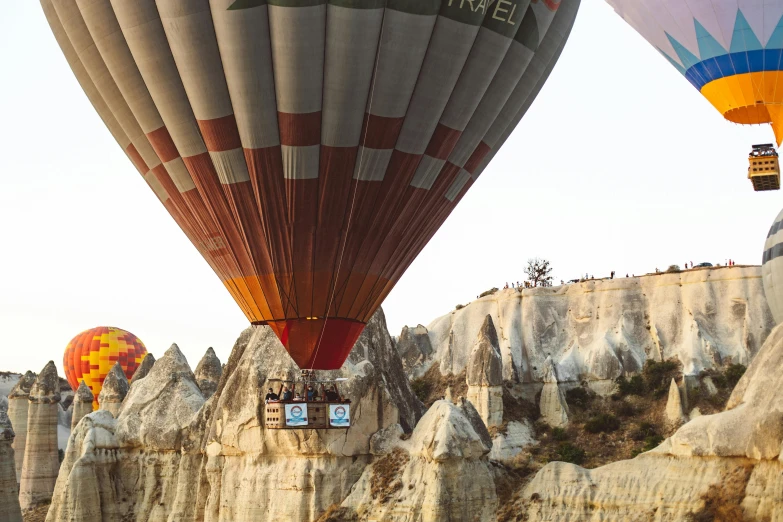 two large  air balloons are being flown