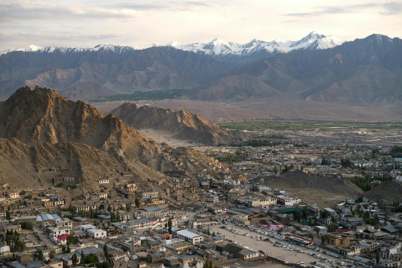 a view from the top of a mountain that has a lot of buildings and houses