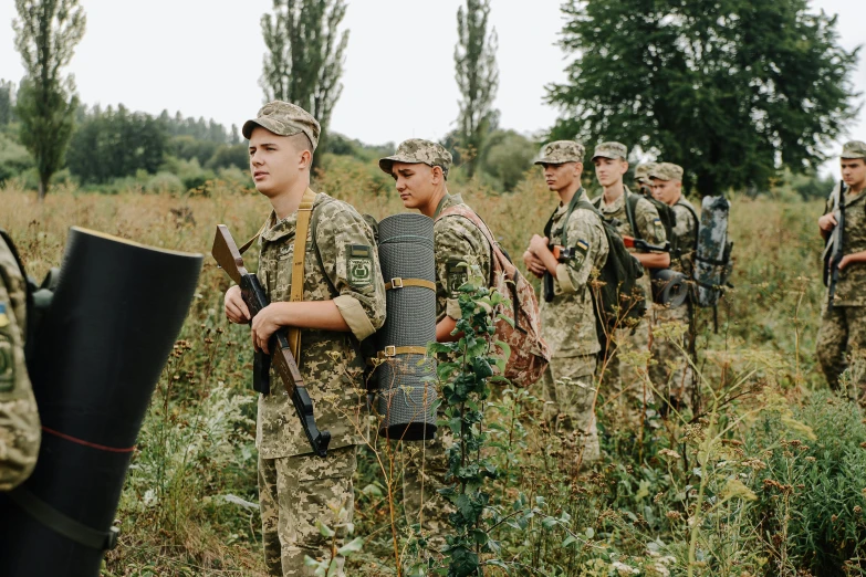 an image of military men that are holding rifles