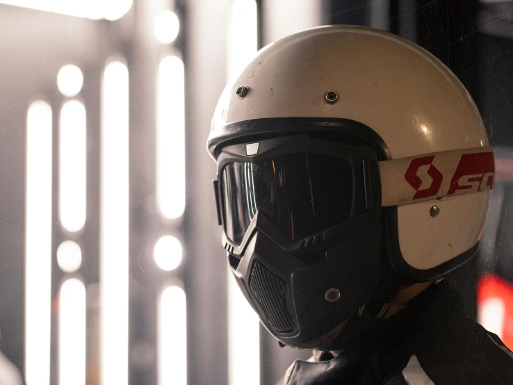 a helmet sits on a chair next to some lights