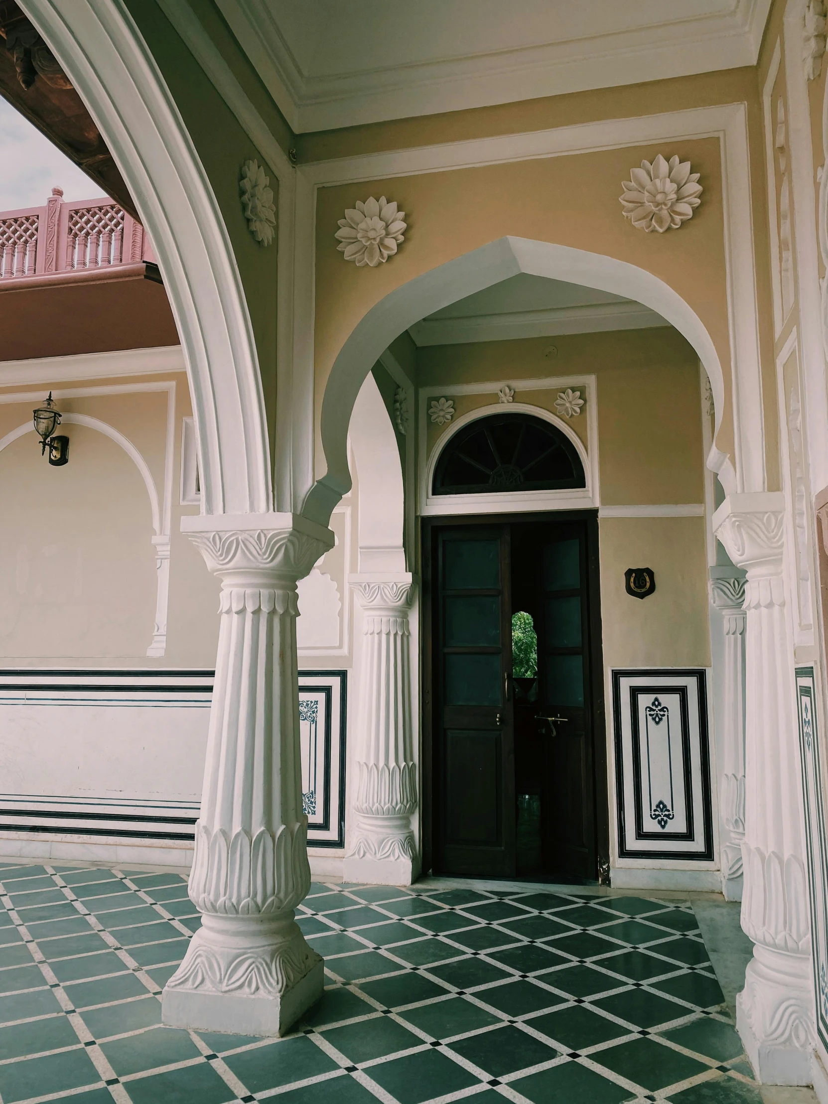 a beautiful doorway with a black and white wall