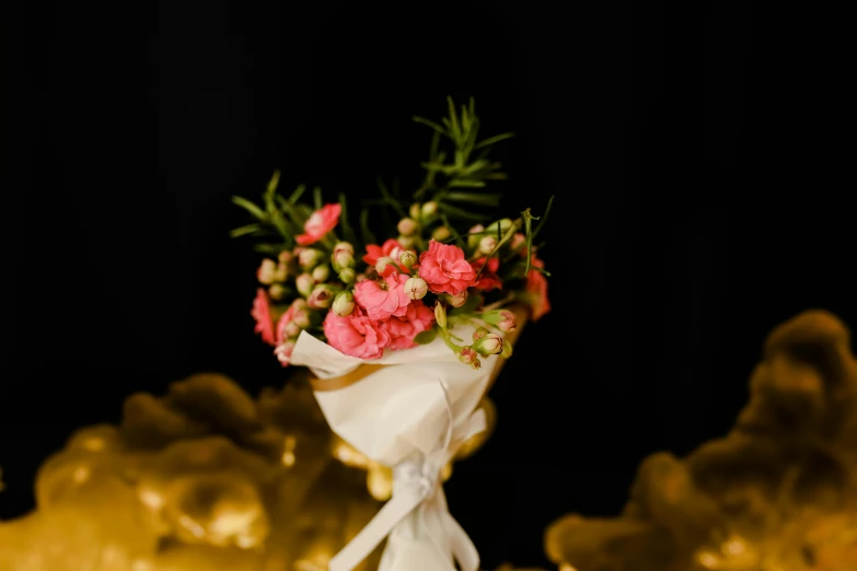 a bouquet of flowers with green and red flowers