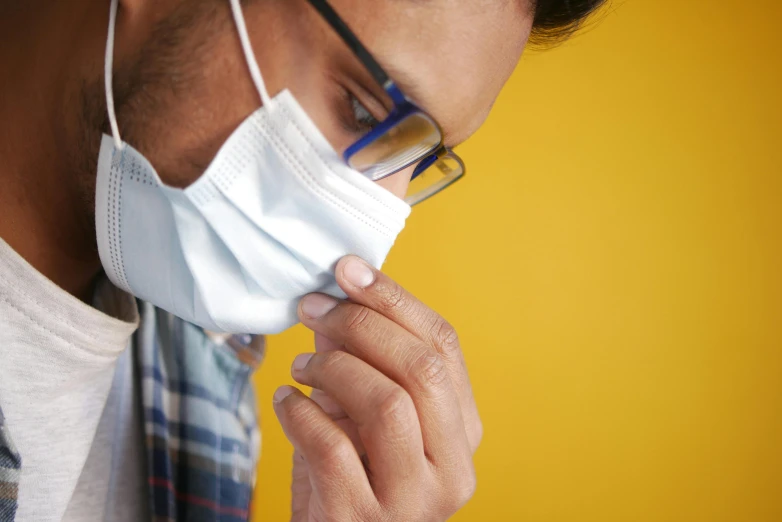 man in glasses and a face mask on his nose