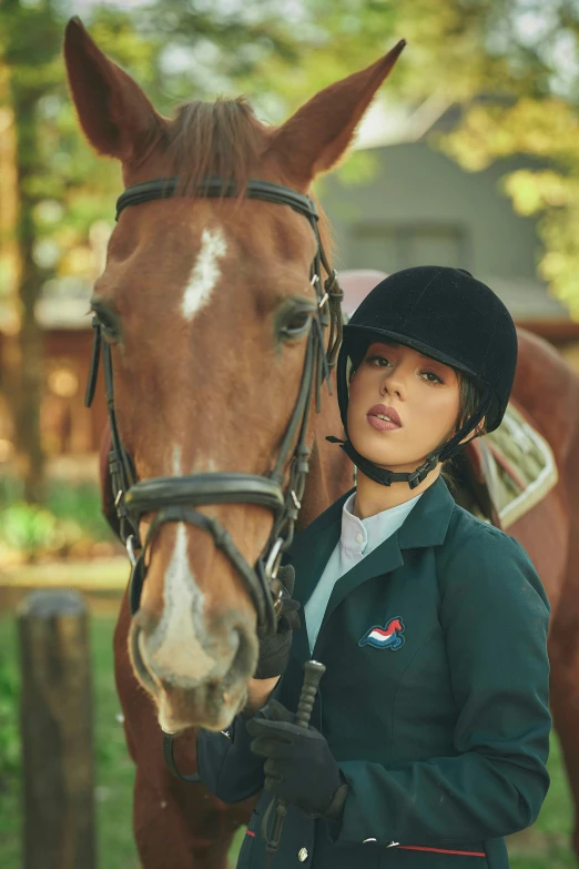 a woman holding the reigns of her horse