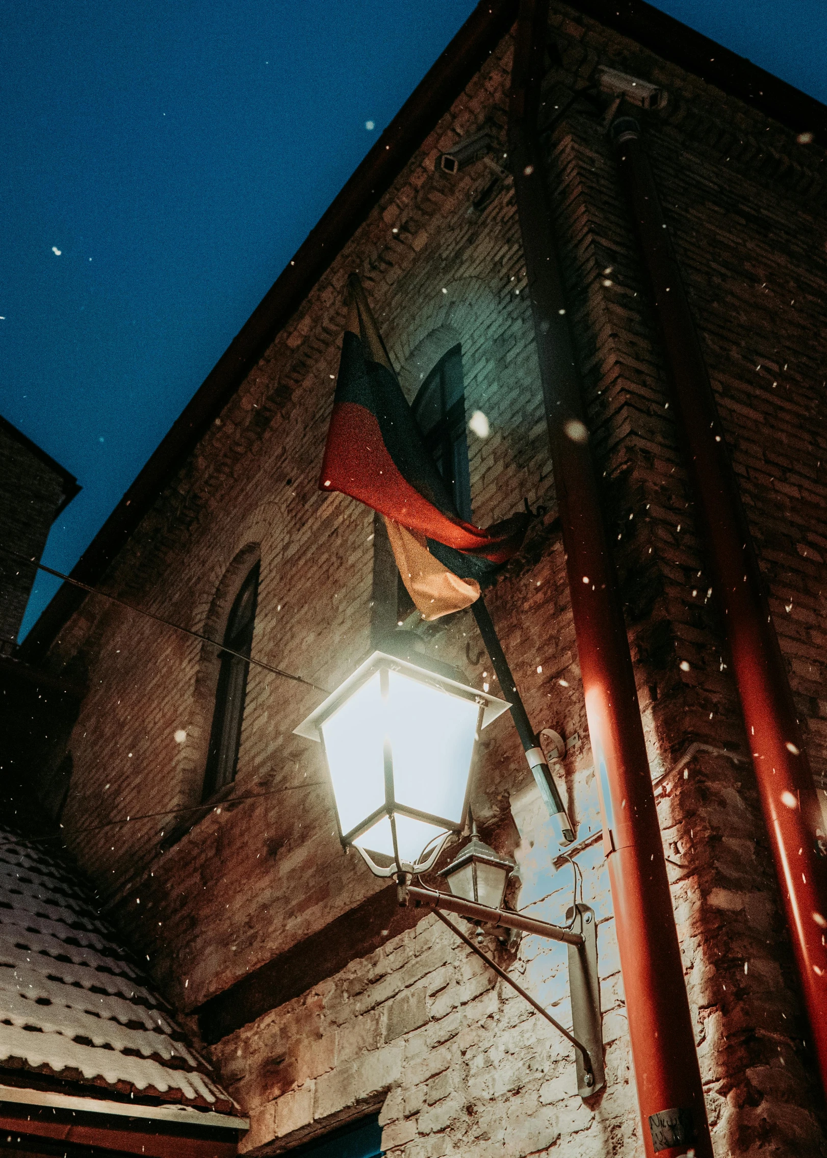 an old building with lights and lights on