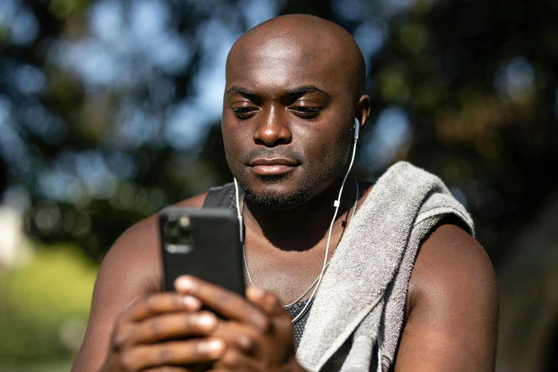 a man is looking at his cell phone