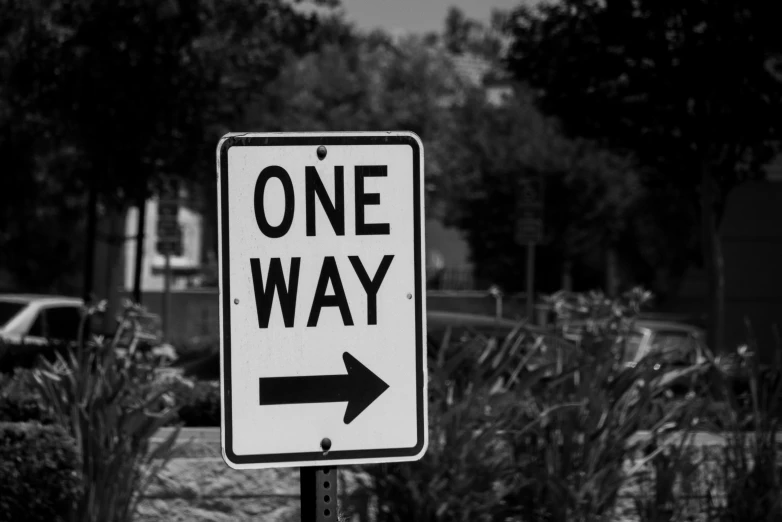 one way sign with an arrow pointing in the direction