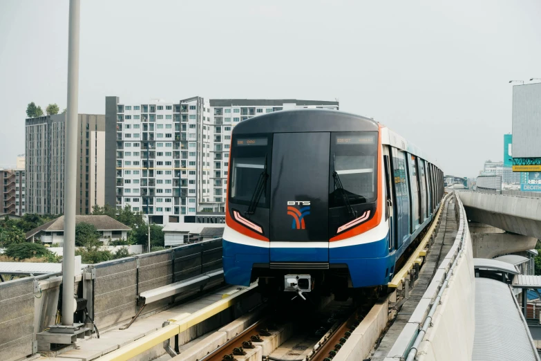 a train that is on a track near buildings