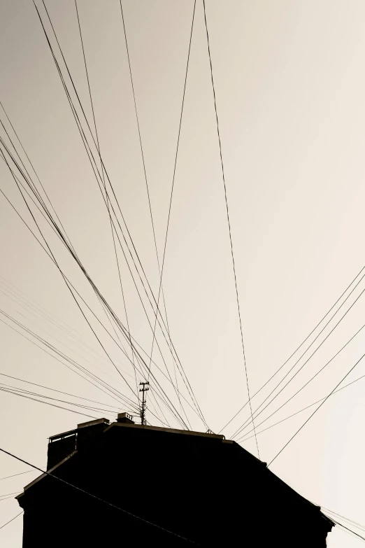 a view of power lines over the top of a building