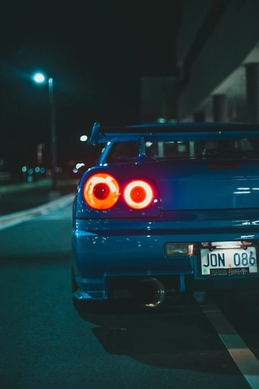 a car parked on a street at night