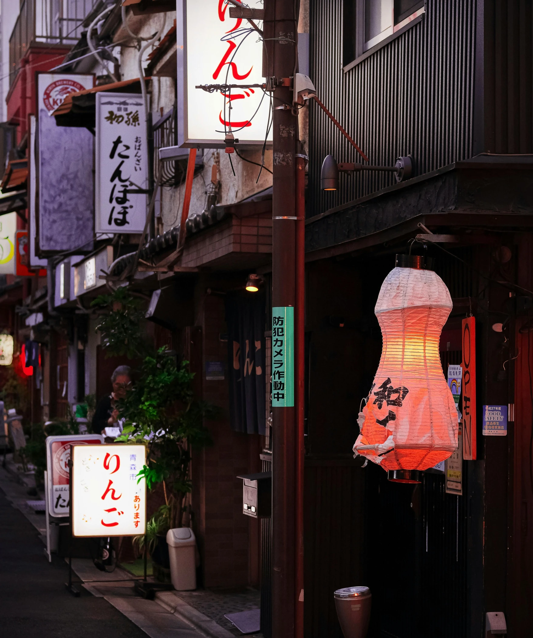 some asian street signs lights signs and buildings