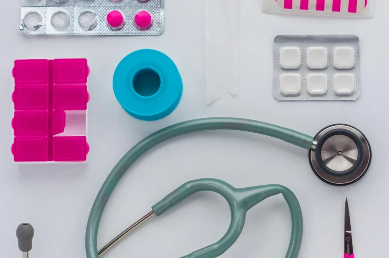 pills, scissors and medical equipment on a table