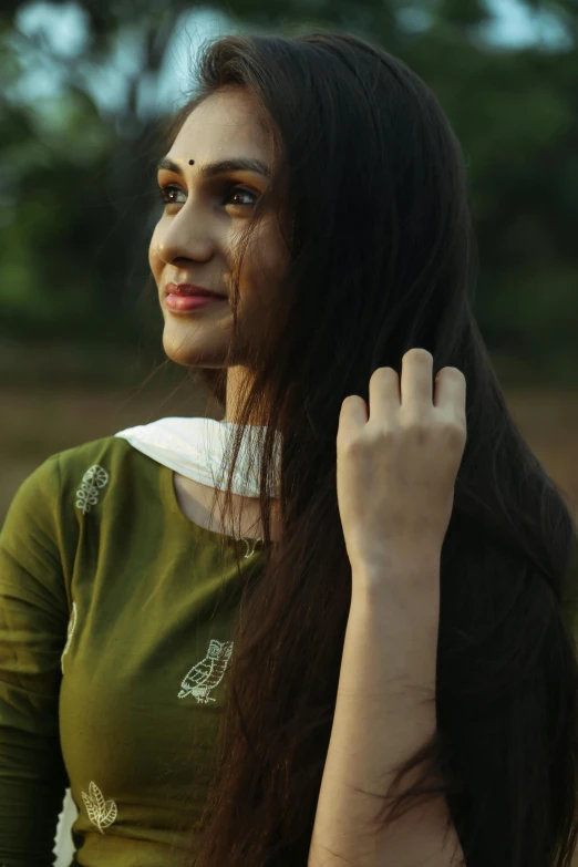 woman showing off ring - like hairs and long black hair