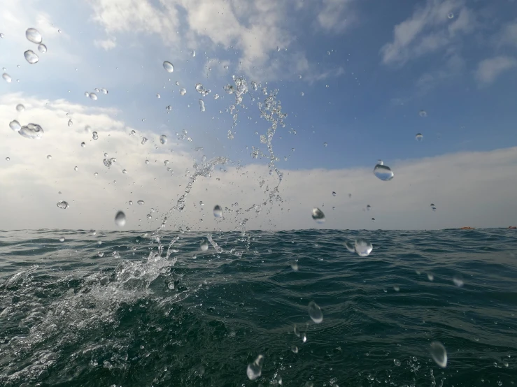 water is splashing on the surface of the ocean