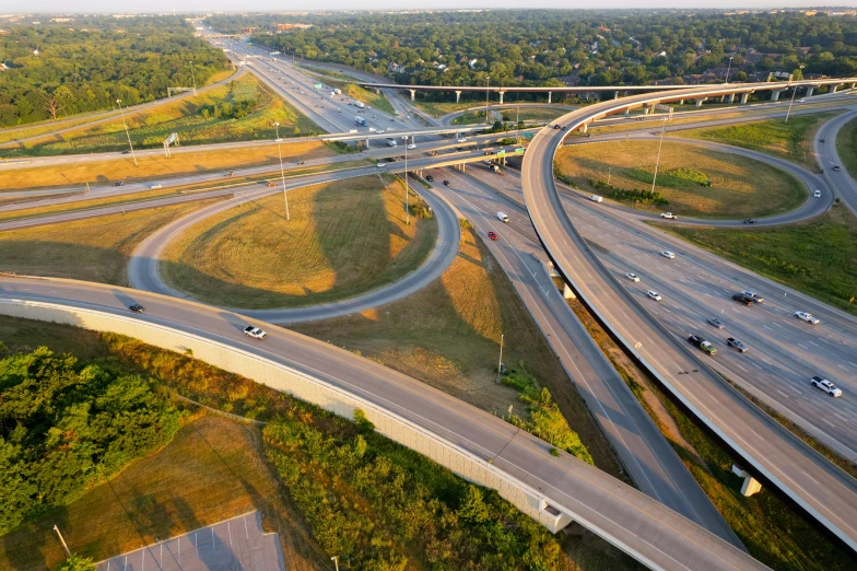 an aerial view of freeways and bridges in a city