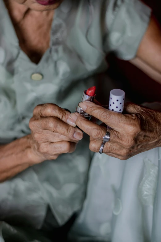 a woman sitting down and holding a dice