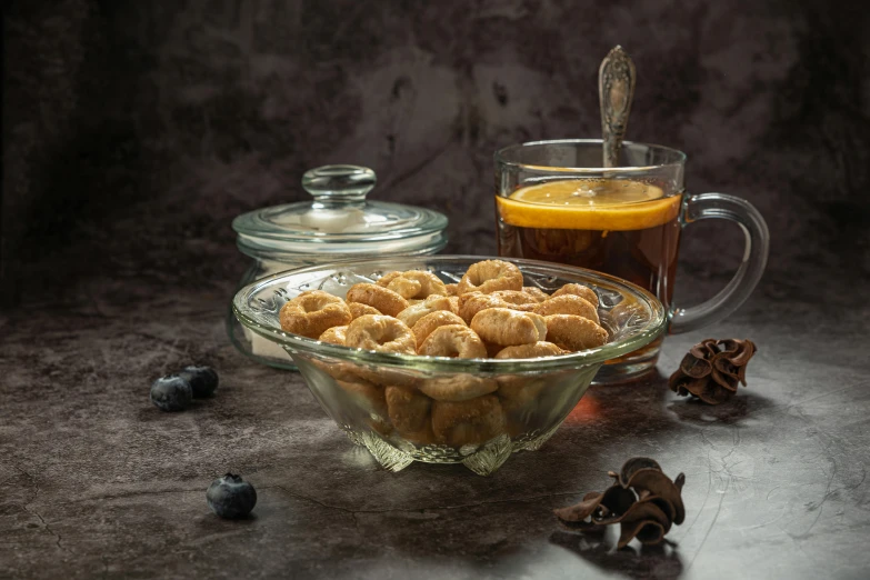 there are some small desserts on a plate with a cup