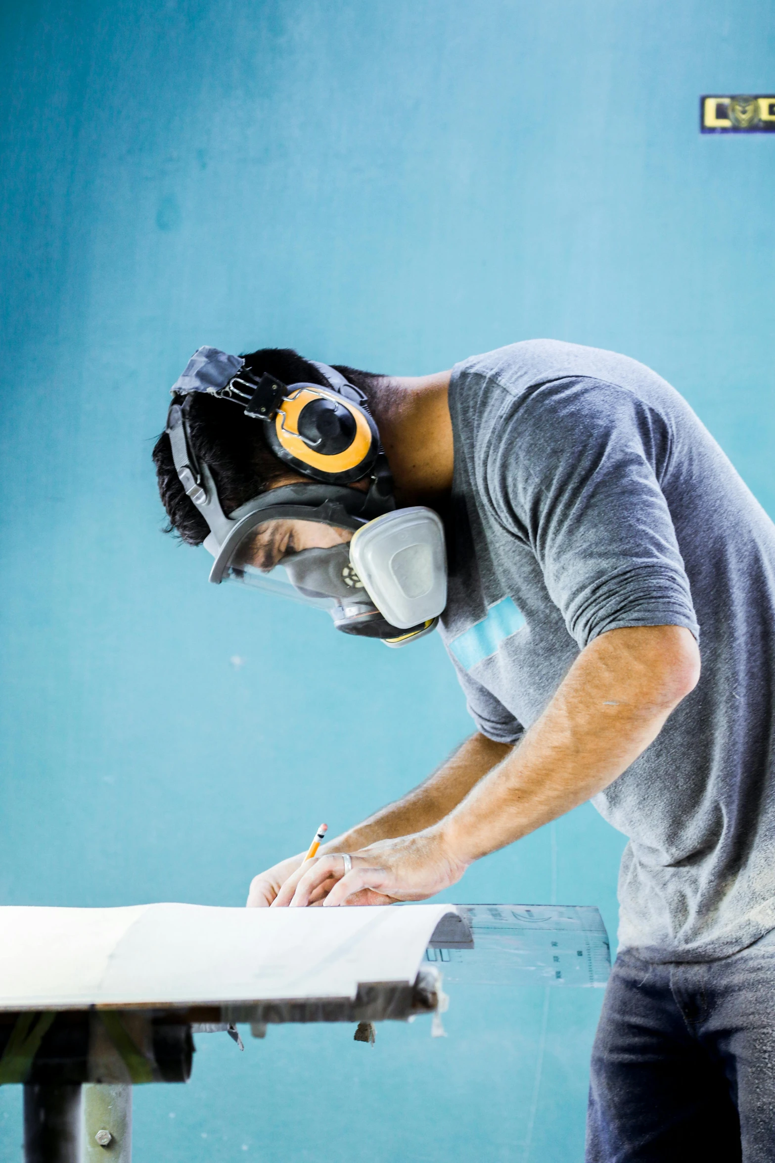 man  paper with mask and scissors for welding equipment