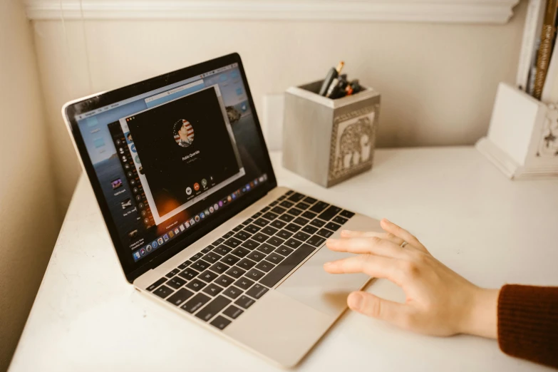 an image of a person on a computer on a desk