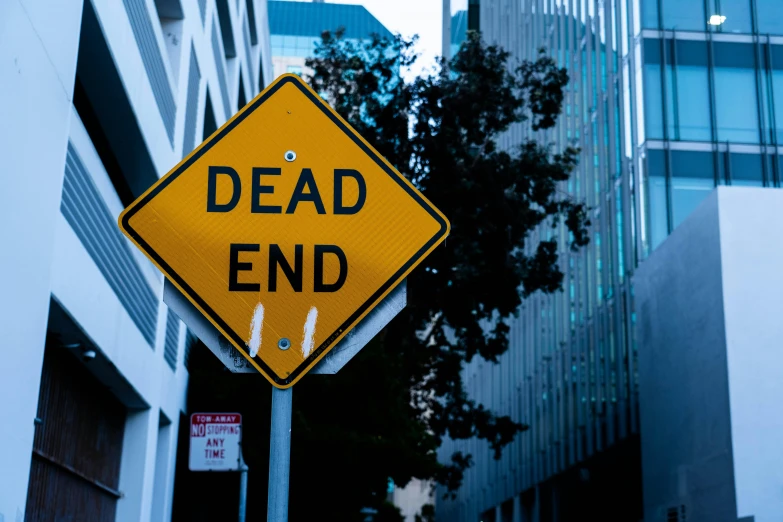 the road sign is telling drivers that dead end is right ahead