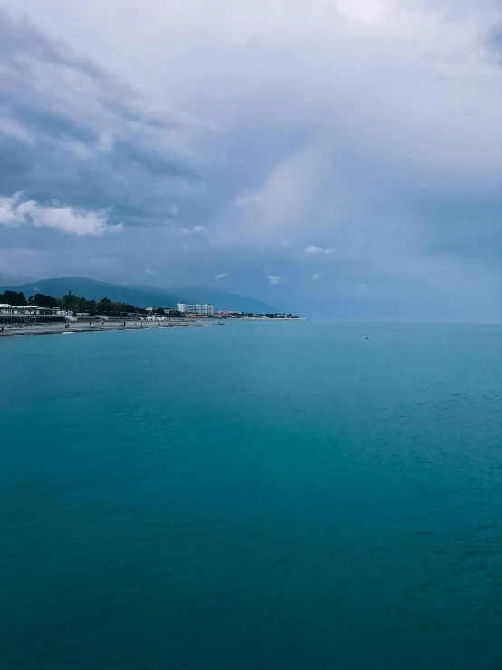 a picture taken from the ocean looking towards some houses