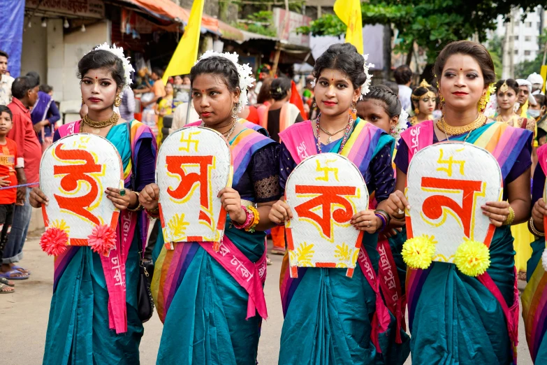 group of women holding signs with the words written on them