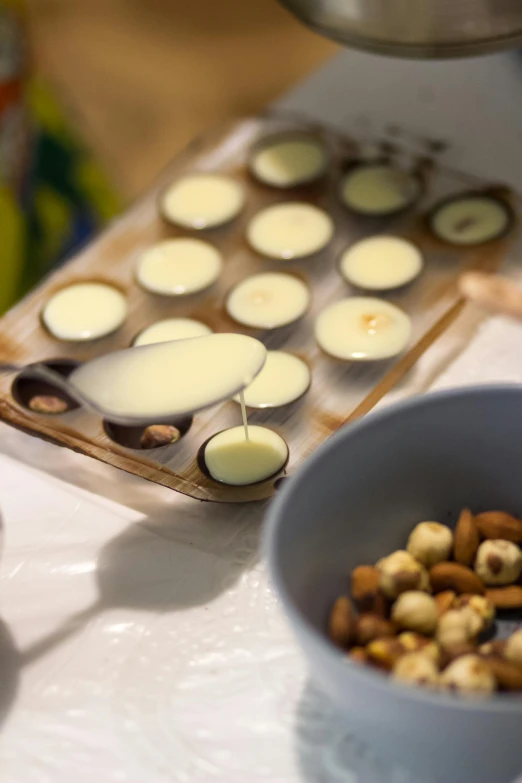 the batter is in the cup next to the small bowl