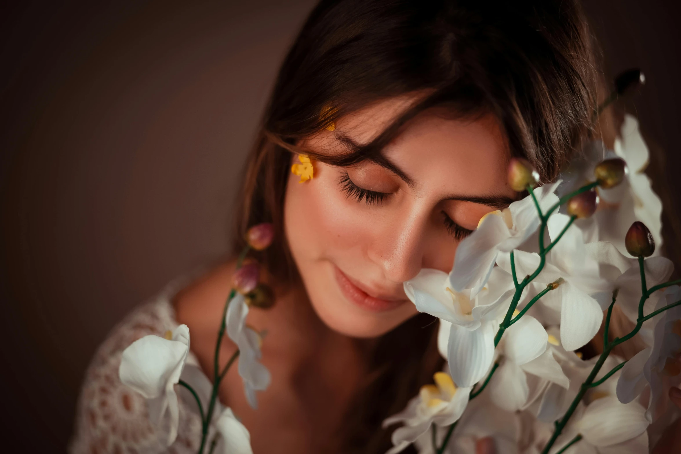 a woman is holding a bouquet of flowers