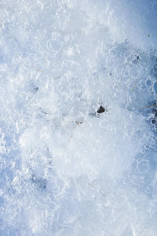 a small fire hydrant is surrounded by snow