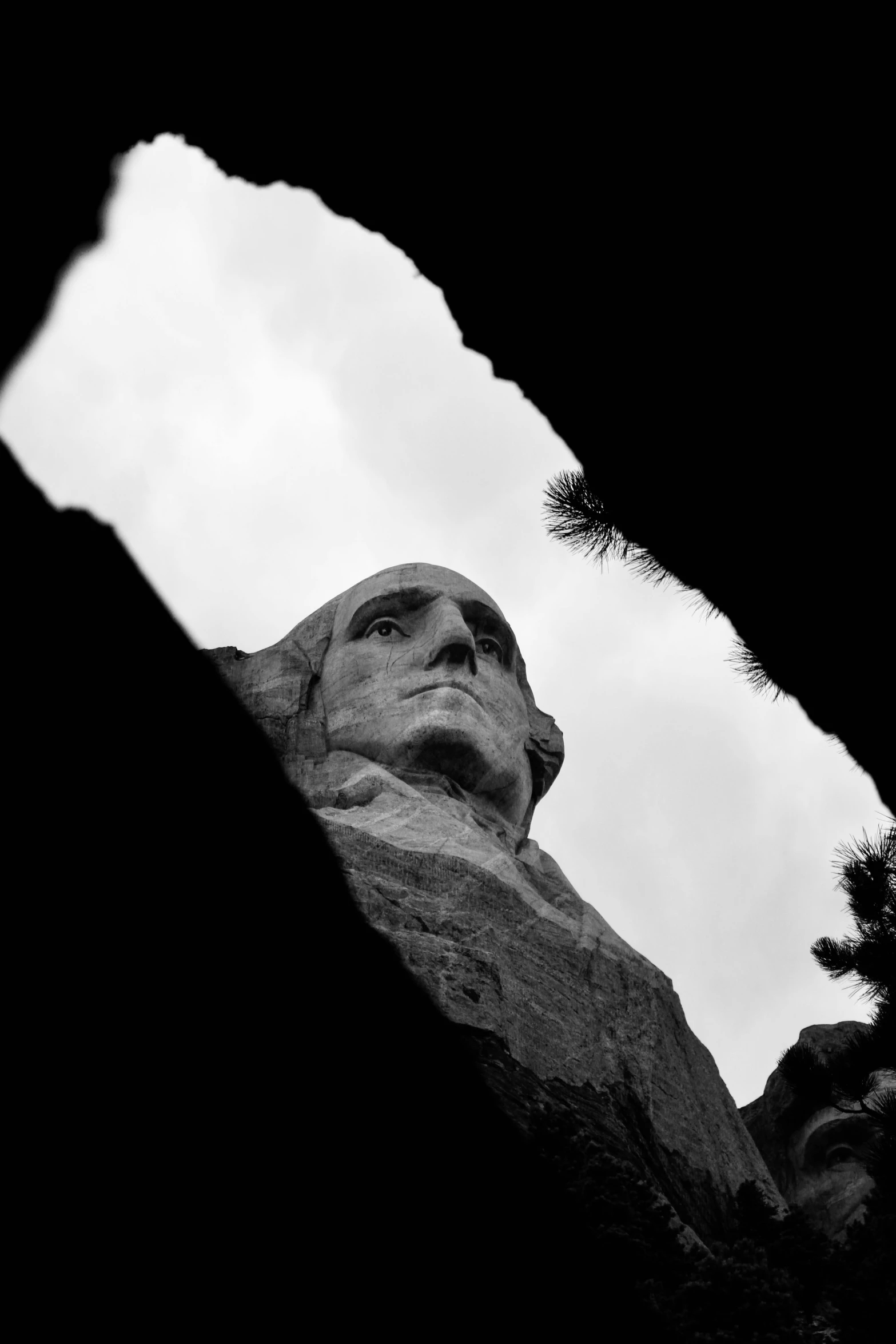 a black and white po of the face of a statue