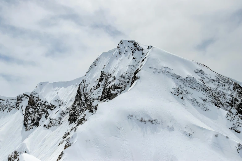 the view from a mountain looking up at a mountain