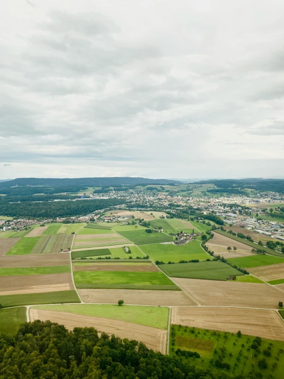 an aerial view of the countryside near a town