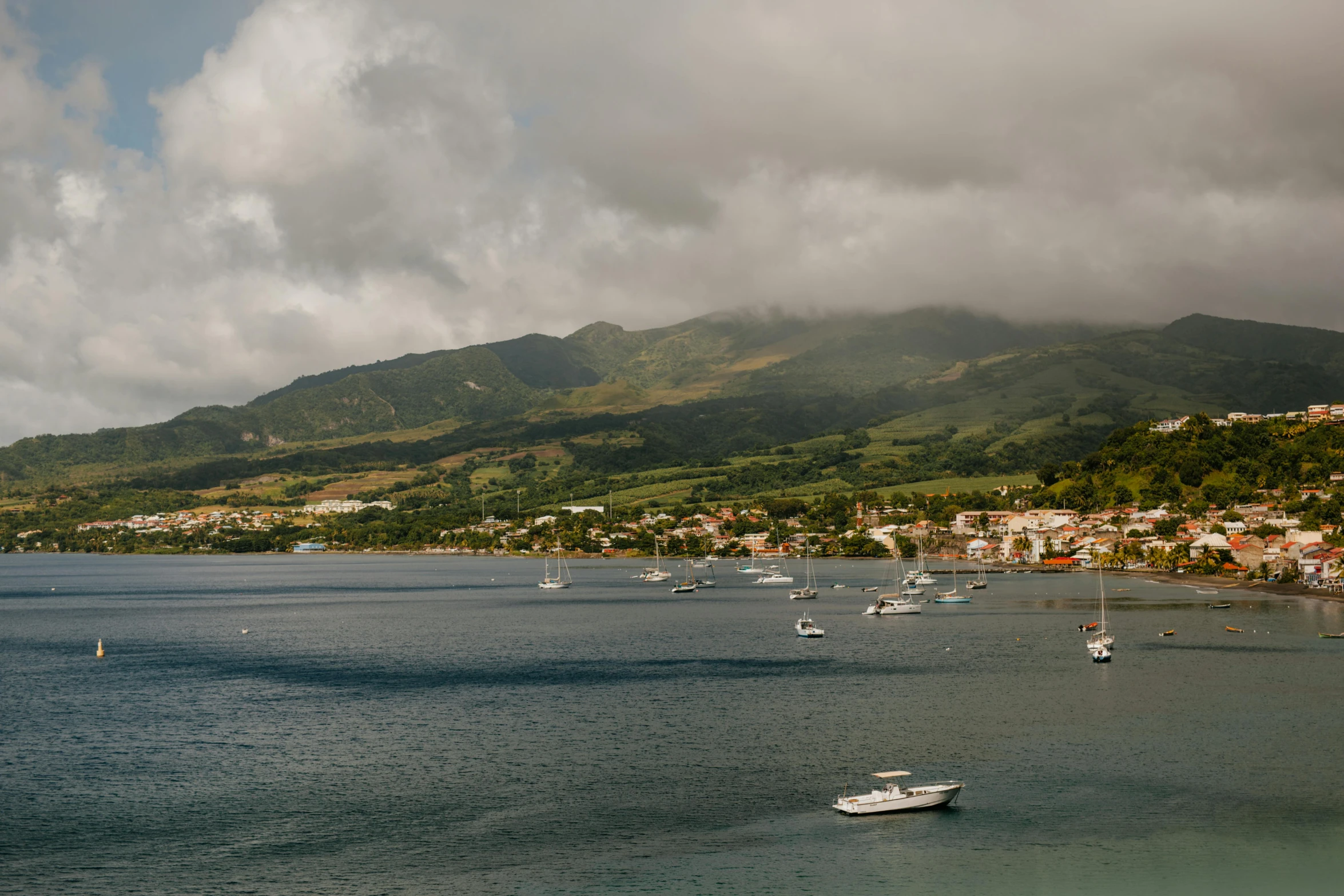 a small body of water with many boats in it