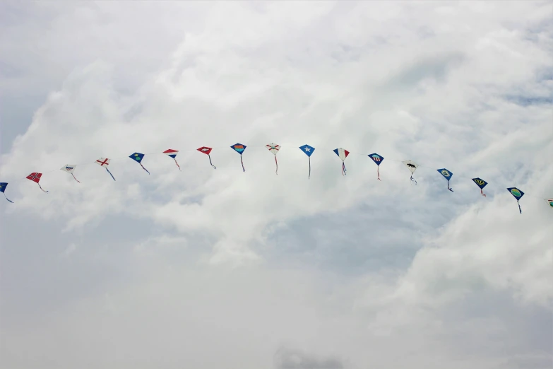 several colorful kites flying in the air