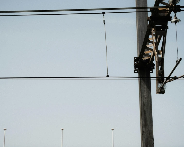 an electric pole with power lines on it