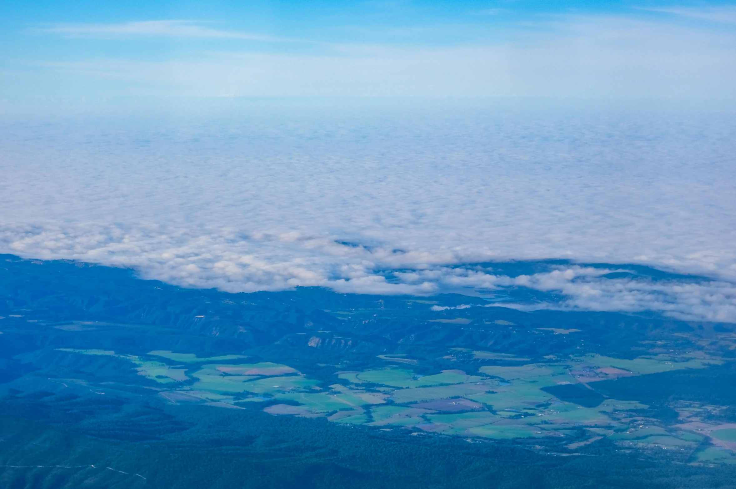 the aerial po shows a scenic landscape and mountains