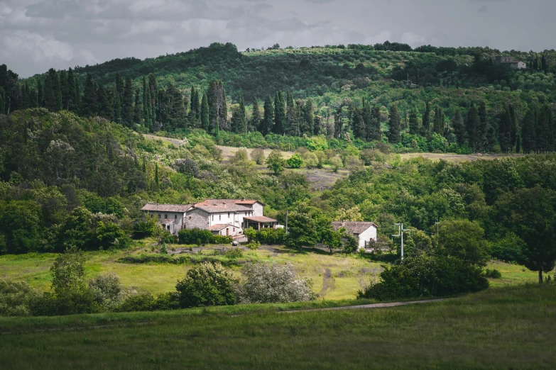 a large house sits on the side of a hill