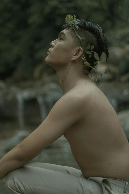 a  man is posing in the water