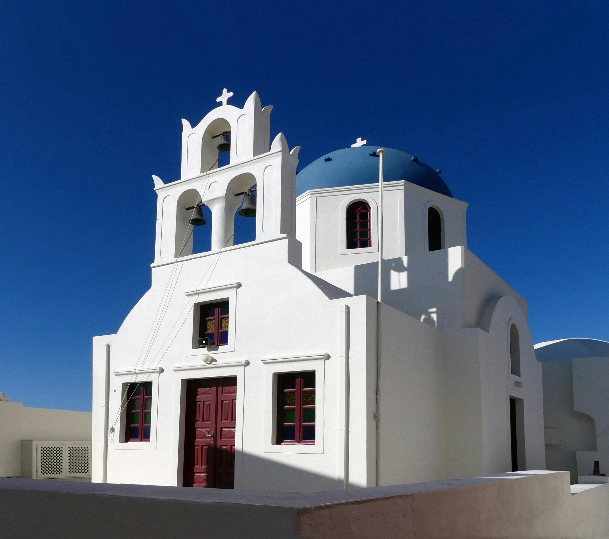 a white church with a blue roof