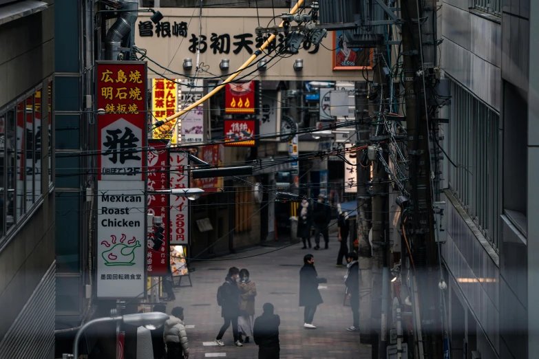 an alleyway that has lots of people in it