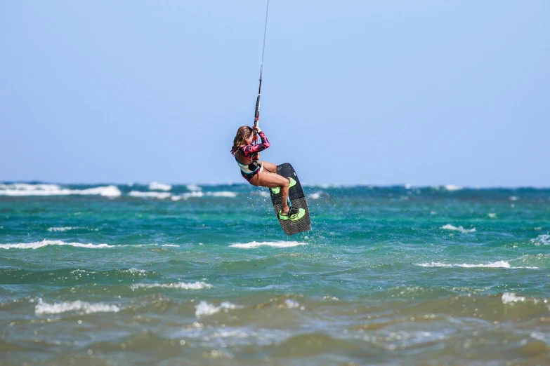 someone is parasailing over the ocean water