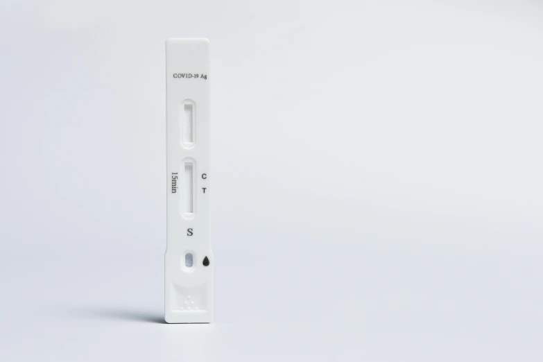 a white wii remote sitting on top of a white table
