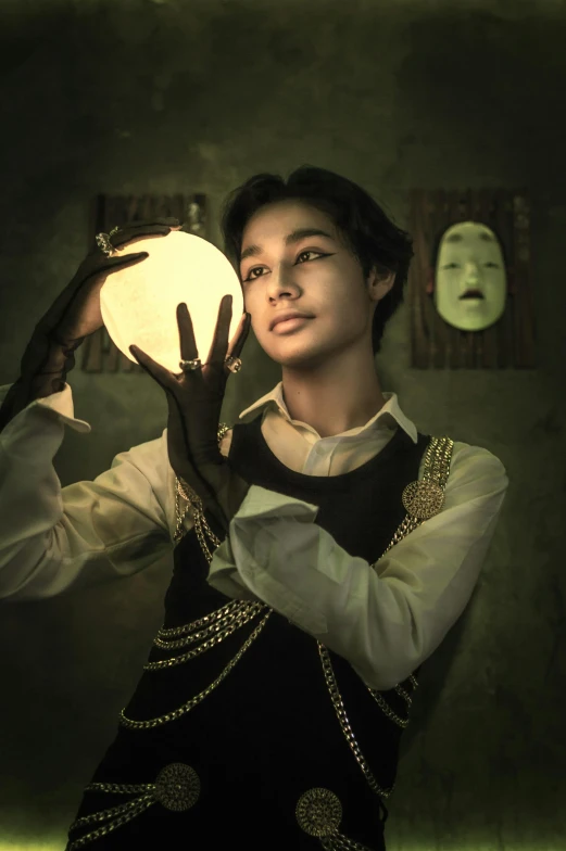 woman holding up a lit object to her head