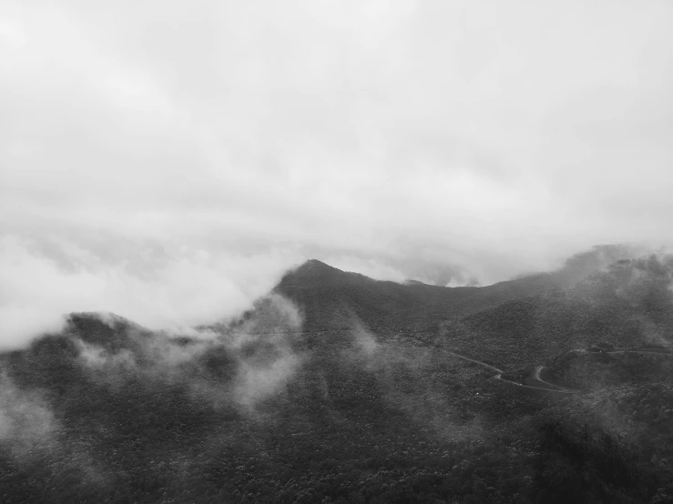 a dark colored black and white po of mountains